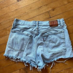 Levi’s 501 denim shorts distressed light wash
